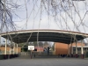 Curved roof school court shelter with safety padded posts - VIC